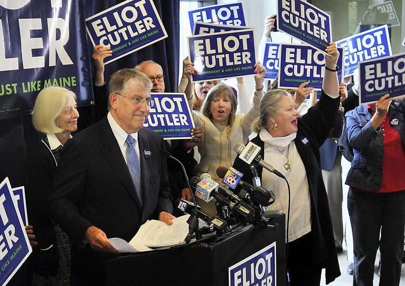With wife Melanie Cutler behind him, Eliot Cutler announces his independent candidacy for Maine governor at a press conference Tuesday, Sept. 24., 2013 at the Gulf of Maine Research Institute in Portland.