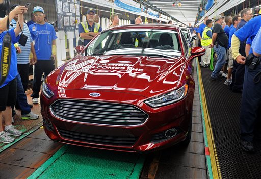 A new 2014 Ford Fusion is displayed on the line in Flatrock, Mich. last week. For the first time, Ford is making its Fusion sedan in the U.S.