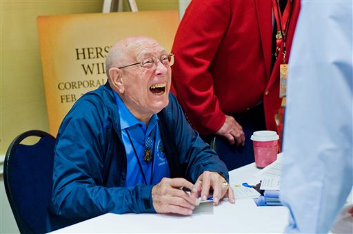 Hershel W. Williams shares a laugh with a conference attendee during the autograph session in Gettysburg. Williams was a corporal in the Marine Corps at Iwo Jima during World War II.