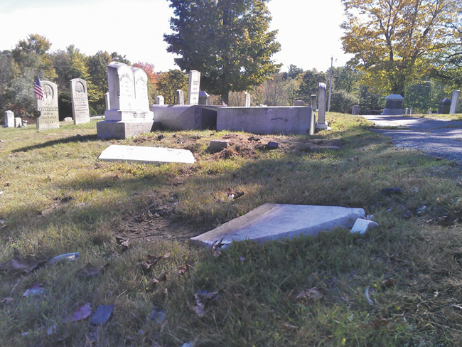 Police say a mother and daughter caused an estimated $35,000 of damage to headstones in Monmouth Ridge Cemetery on Friday.