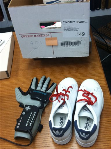 This undated photo provided by the New York Public Library shows Timothy Leary's Nintendo power glove and sneakers.