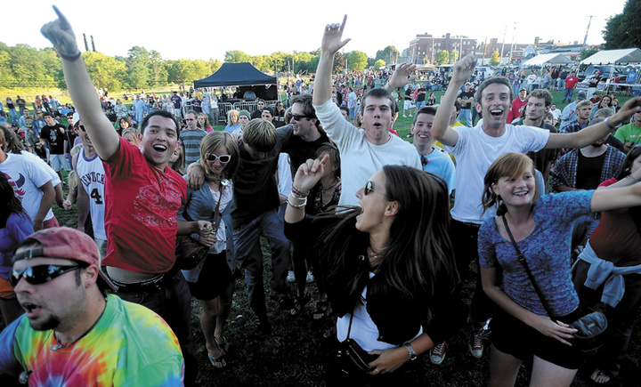 In this September 2012 file photo, fans dance to the musical styling of Rustic Overtones at the 4th annual Hill 'n the Ville Music Festival at the Head of Falls on Front Street in Downtown Waterville.