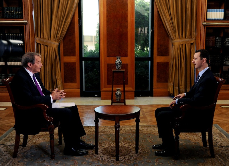 In this Sunday, Sept. 8, 2013 photo released by the Syrian official news agency SANA, PBS host Charlie Rose, left, interviews Syrian President Bashar Assad at the presidential palace in Damascus, Syria. In an interview broadcast Monday, Sept. 9, 2013 on "CBS This Morning," Assad denied responsibility and accused the Obama administration of spreading lies without providing a "single shred of evidence," he warned that air strikes against his nation could bring retaliation. (AP Photo/SANA)