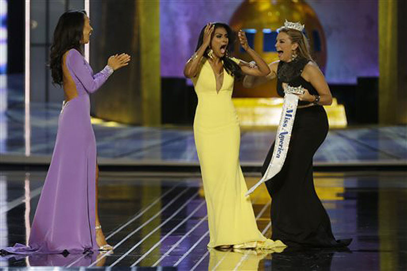 Miss New York Nina Davuluri, center, reacts Sunday after being named Miss America 2014 as Miss California Crystal Lee, left, and Miss America 2013 Mallory Hagan celebrate with her.