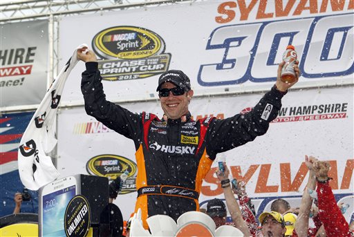 NASCAR driver Matt Kenseth celebrates in Victory Lane after winning the NASCAR Sprint Cup Series auto race at New Hampshire Motor Speedway, Sunday.