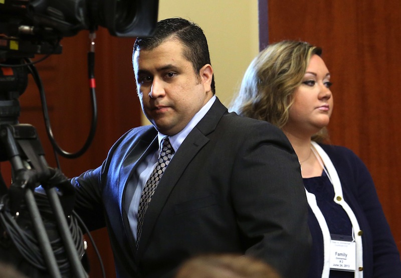 In this Monday, June 24, 2013 file photo, George Zimmerman, left, arrives in Seminole circuit court with his wife, Shellie, on the 11th day of his trial, in Sanford, Fla. George Zimmerman's wife filed for divorce Thursday, Sept. 5, 2013 less than two months after her husband was acquitted of murdering Trayvon Martin and a week after she pleaded guilty to perjury in his case. (AP Photo/Orlando Sentinel, Joe Burbank, Pool, File)