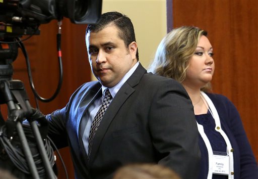 George Zimmerman, left, arrives in Seminole circuit court with his wife, Shellie, on June 24, 2013 – the 11th day of his trial – in Sanford, Fla.