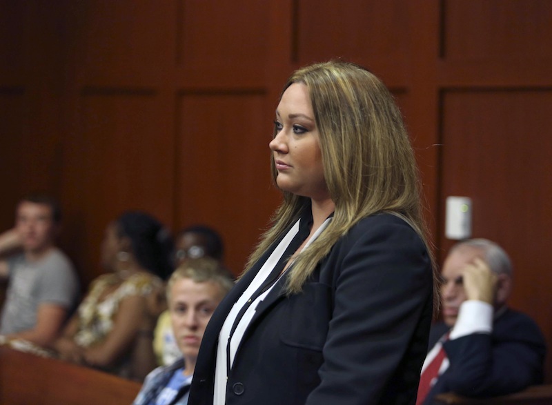 Shellie Zimmerman, wife of George Zimmerman, appears at the Seminole County Courthouse in Sanford, Fla. on Aug. 28. She filed for divorce on Thursday, her defense lawyer confirmed.