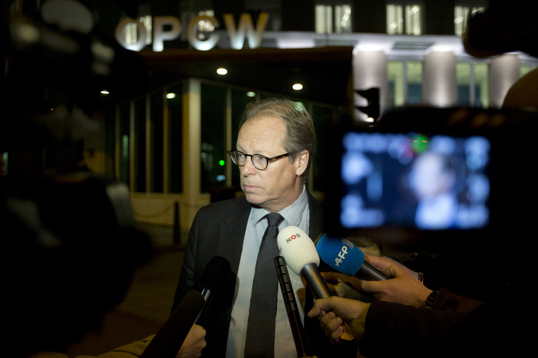 Spokesman Michael Luhan gives a brief statement outside the headquarters of the Organization for the Prohibition of Chemical Weapons in The Hague, Netherlands, on Friday. The global chemical weapons watchdog has scheduled a meeting to approve a U.S.- and Russian-brokered plan to rapidly verify, secure and then destroy Syria's arsenal of poison gas and nerve agents.