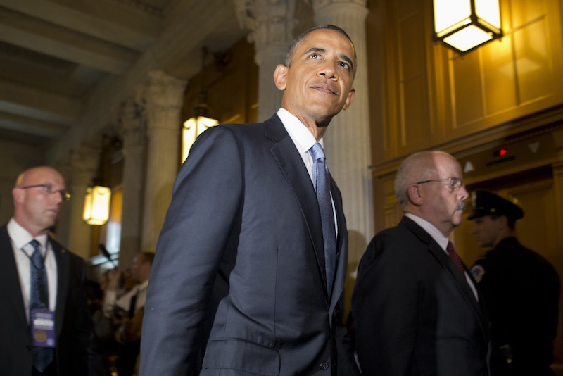 President Barack Obama, accompanied by Senate Sergeant at Arms and Doorkeeper Terrance Gainer, right, leaves a meeting with congressional Republicans on Capitol Hill in Washington, Tuesday, Sept. 10, 2013, where they discussed Syria. On Tuesday night, the president will address the nation on Syria. (AP Photo/Jacquelyn Martin)