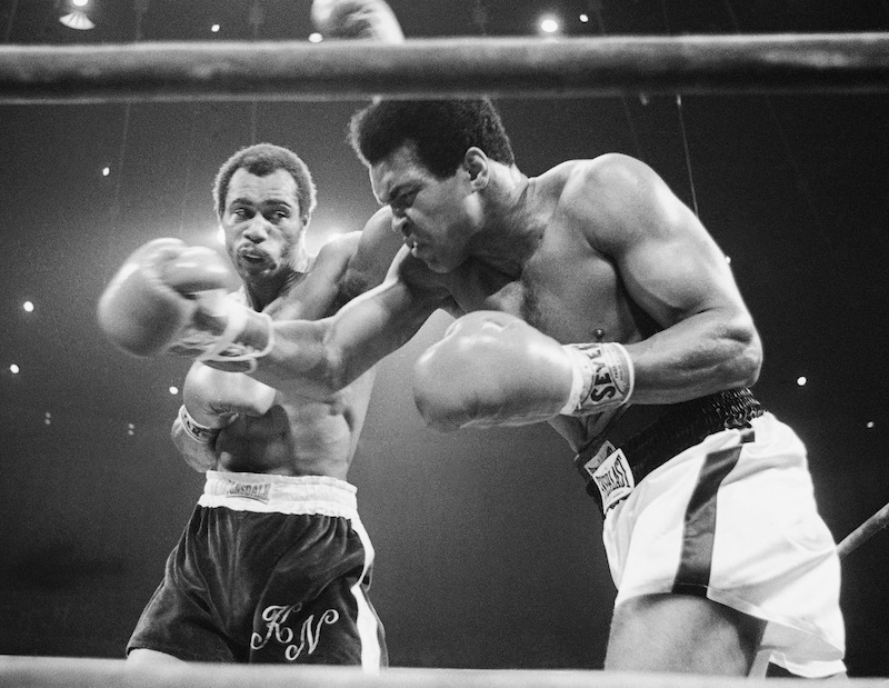 In this Sept. 10, 1973, file photo, Muhammad Ali, right, winces as Ken Norton hits him with a left to the head during their re-match at the Forum in Inglewood, Calif. Norton, a former heavyweight champion, has died, his son said, Wednesday, Sept. 18, 2013. He was 70. (AP Photo/File) Competition Challenge Boxing Ring Aggression Action Boxing Glove