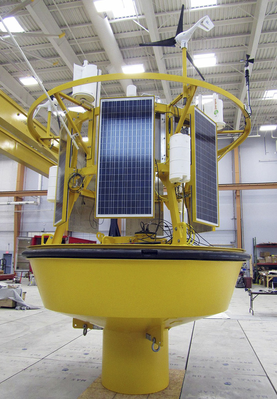 In this May 2013 file photo, a data-collection buoy that was deployed in the Gulf of Maine in June, which can track wind speeds overhead. Two environmental groups are pressing state utility regulators and the University of Maine to release a controversial proposal for a demonstration offshore wind power project – a document the university has declined to make public. (AP Photo/University of Maine)