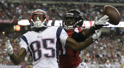 New England Patriots wide receiver Kenbrell Thompkins (85) vies for a thrown ball against Atlanta Falcons cornerback Desmond Trufant (21) during the second half of Sunday's game. NFLACTION13; Georgia Dome