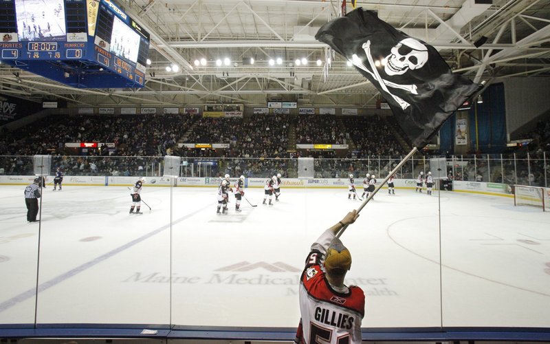 In this 2010 file photo, Dan Bailey of Yarmouth waves the Jolly Roger during a game between the Portland Pirates and Manchester Monarchs at the Cumberland County Civic Center. The Cumberland County Civic Center's trustees and the owner of the Portland Pirates may be headed to court after failing to reach an agreement on a lease that would keep the American Hockey League team playing at the arena for at least five more years.