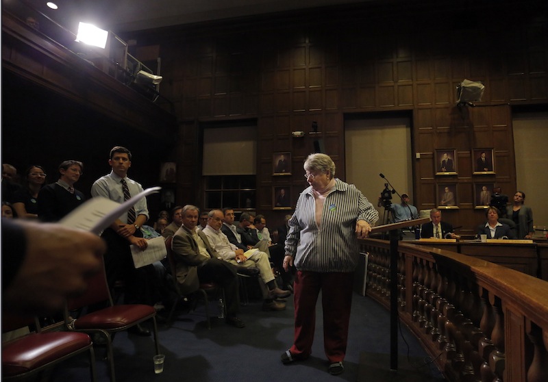Bonnie Johnstone of Portland leaves the podium at the Portland City Council chambers after speaking in opposition to the sale of Congress Square Monday, September 9, 2013.