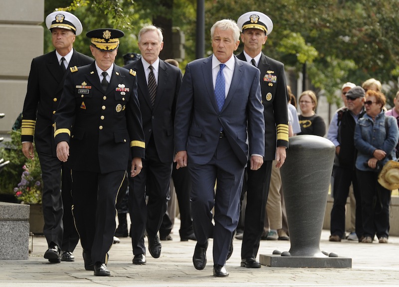 From L-R: Vice Chairman of the Joint Chiefs Adm. Sandy Winnefeld, Chairman of the Joint Chiefs Gen. Martin Dempsey, Navy Secretary Ray Mabus, Defense Secretary Chuck Hagel and Chief of Naval Operations Adm. Jonathan Greenert arrive at a ceremony at the Navy Memorial in Washington, honoring the victims of an attack at the Navy Yard, at the Navy Memorial in Washington, September 17, 2013. Washington authorities questioned on Tuesday how a U.S. military veteran with a history of violence and mental problems could have gotten clearance to enter a Navy base where he killed 12 people before police shot him dead. (REUTERS/Mike Theiler) :rel:d:bm:GF2E99H15H001