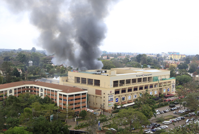 Smoke rises from the Westgate shopping center after explosions at the mall in Nairobi on Monday. :rel:d:bm:GF2E99N14UF01