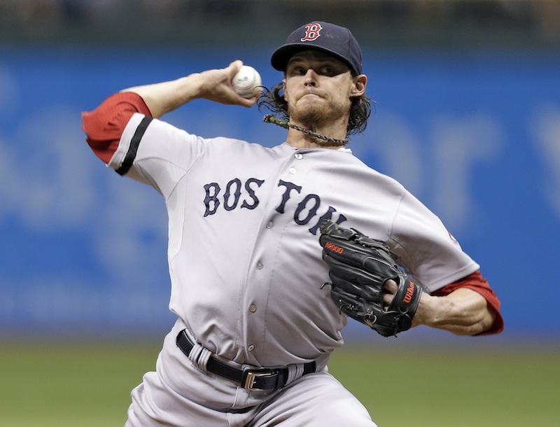 Boston Red Sox starting pitcher Clay Buchholz delivers to Tampa Bay Rays' David DeJesus on Tuesday in St. Petersburg, Fla.