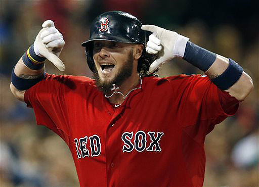 Boston catcher Jarrod Saltalamacchia runs toward the dugout after his grand slam in the seventh inning gave the Red Sox an 8-4 win over the New York Yankees at Fenway Park in Boston on Friday.