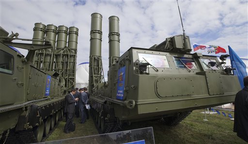 In this Aug. 27, 2013, photo, Russian air defense missile systems are displayed at the opening of an air show in Zhukovsky outside Moscow. Russia could expand arms sales to Iran and revise the terms of U.S. military transit to Afghanistan if Washington launches a strike on Syria, a senior Russian lawmaker said Wednesday.