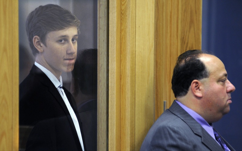 Galileo Mondol, 17, left, of Somerville, Mass., stands with his attorney William A. Korman, right, during his arraignment at Central Berkshire District Court Tuesday, Sept. 3, 2013, in Pittsfield, Mass. Mondol is charged with sexually assaulting three younger students at Camp Lenox on Aug. 25 in Otis, Mass., during a Somerville High School team-building retreat for the soccer team. (AP Photo/The Boston Globe, Christine Peterson, Pool)