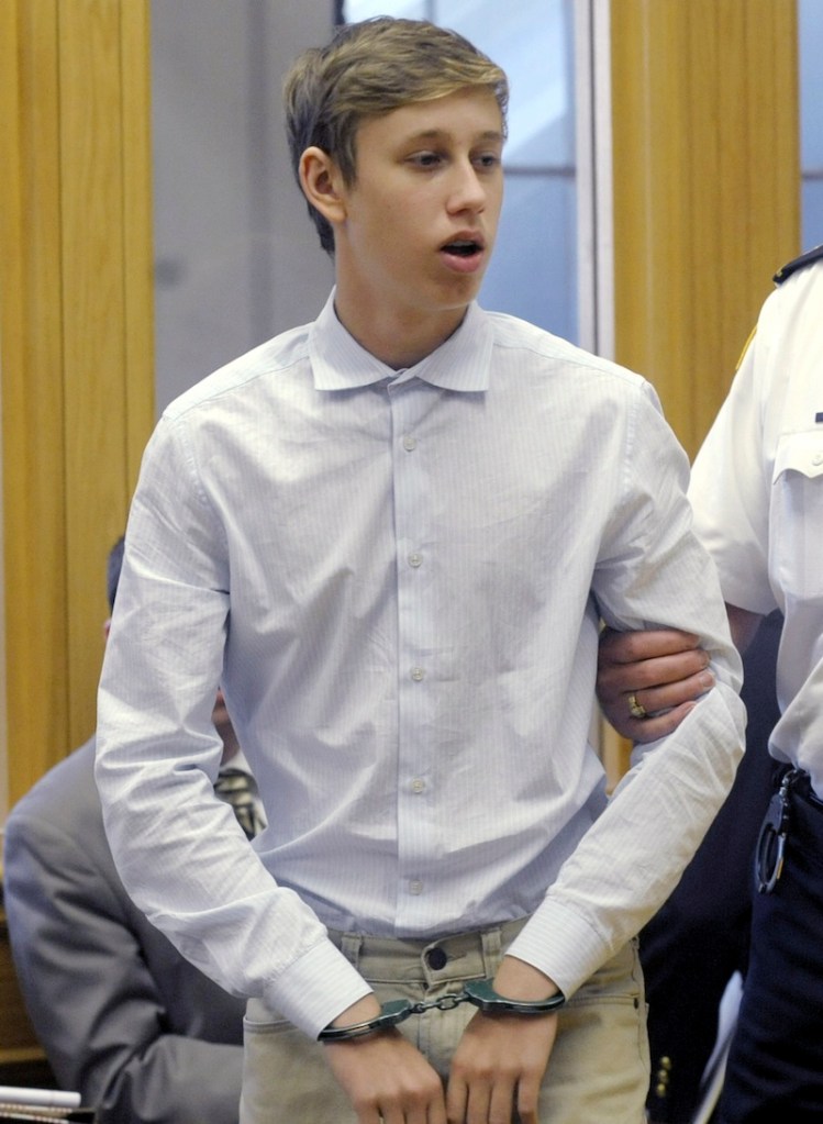 Galileo Mondol, 17, is led into a district court for a hearing on Friday, Sept. 6, 2013, in Pittsfield, Mass. Prosecutors said Mondol is one of three Somerville, Mass., High School soccer players charged in connection with an alleged sexual assault Aug. 25, 2013 in a cabin at Camp Lenox in Otis, Mass. (AP Photo/Boston Herald, Jim Michaud, Pool)