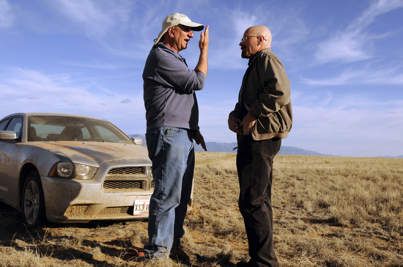 Cinematographer Michael Slovis, left, and Bryan Cranston work on the set of "Breaking Bad." The series finale will air Sunday.