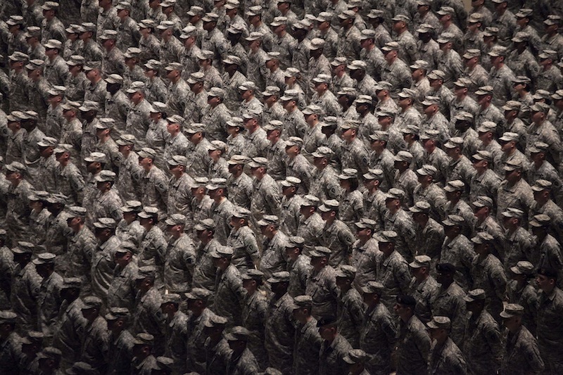 In this Sept. 26, 2010, file photo, members of the 36th Infantry Division of the Texas Army National Guard participate in a ceremony on the floor of the Frank Erwin Center in Austin, Texas. The Texas National Guard is refusing to process requests for benefits submitted by same-sex couples because of the state constitution's definition of marriage. The American Military Partner Association gave a letter to The Associated Press on Tuesday, Sept. 3, 2013, that was written by Maj. Gen. John Nichols, the commanding general of Texas Military Forces, stating that because the Texas Constitution defines marriage as between a man and a woman, his state agency couldn’t process applications from gay and lesbian couples. (AP Photo/The Daily Texan, Tamir Kalifa, File) 36th Infantry Division Texas National Guard Frank Erwin Center U.S. Military Iraq