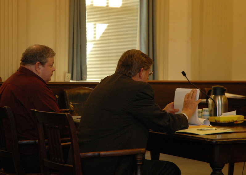 Timothy Courtois, left, sits next to his attorney, Clifford Strike, at a hearing Thursday in York County Superior Court in Alfred. Timothy Courtois