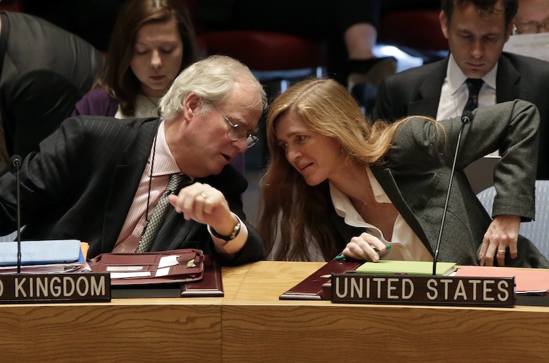 British Ambassador Mark Lyall Grant and U.S. Ambassador Samantha Power confer in the United Nations Security Council, Tuesday, Sept. 17, 2013. Moscow insisted on Tuesday that a new Security Council resolution on Syria not allow the use of force, while the Arab country's main opposition group demanded a swift international response following the U.N. report that confirmed chemical weapons were used outside Damascus last month. (AP Photo/Richard Drew)