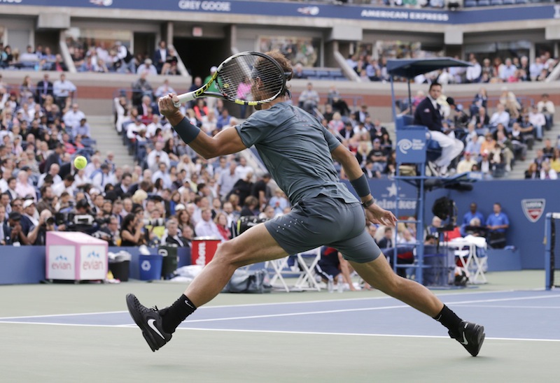 Rafael Nadal, of Spain, returns a shot to Novak Djokovic, of Serbia, during the men's singles final of the 2013 U.S. Open tennis tournament, Monday, Sept. 9, 2013, in New York. (AP Photo/Charles Krupa)