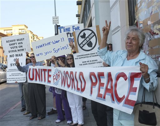 Anti-war activists rally for peace in Los Angeles last week. A breakthrough agreement on the destruction of Syrian chemical weapons was announced by the U.S. and Russia early Saturday, averting a military strike for the time being.