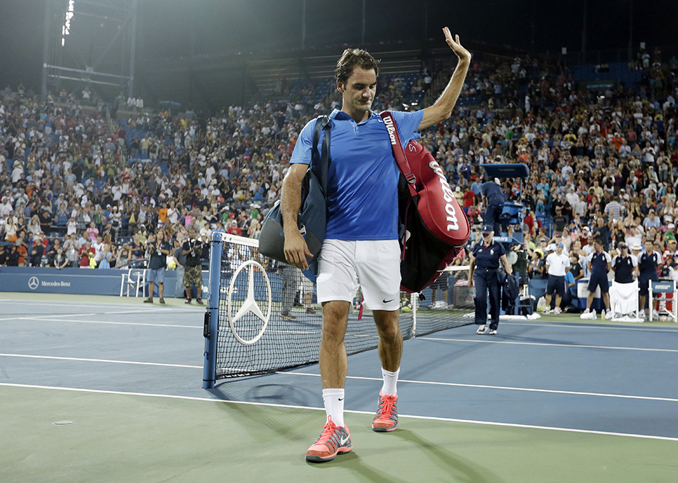 Roger Federer, of Switzerland, walks off the court after losing in straight sets to Tommy Robredo, of Spain, during the fourth round of the 2013 U.S. Open tennis tournament, Monday, Sept. 2, 2013, in New York. (AP Photo/Darron Cummings)