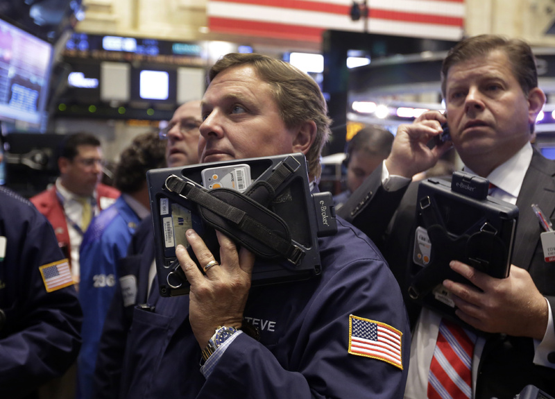 Traders Stephen Mara, left, and Edward Schreier work on the floor of the New York Stock Exchange on Wednesday.