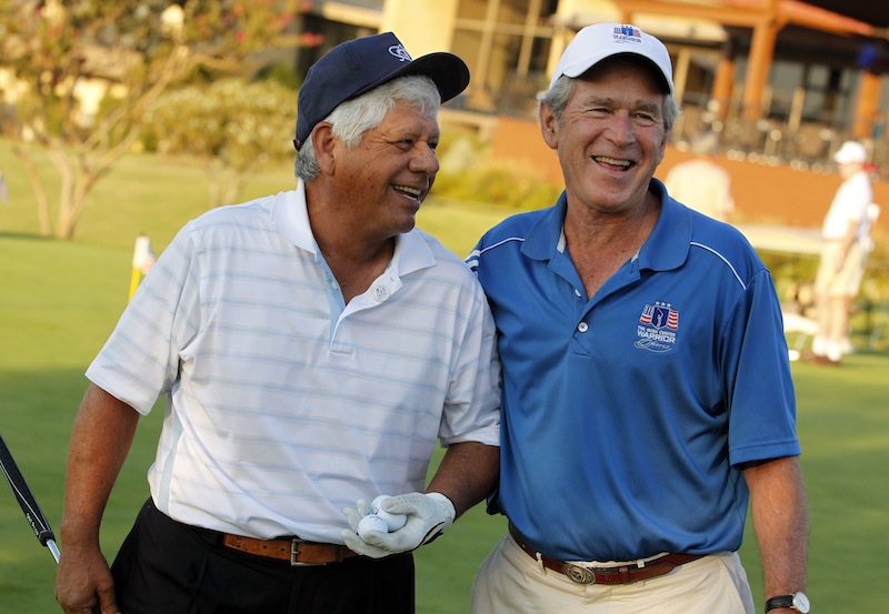 In this Sept. 26, 2013, photo, Lee Trevino and former president George W. Bush laugh prior to the Bush Center Warrior Open golf pro-am tournament for wounded veterans at the Las Colinas Country Club in Irving, Texas.