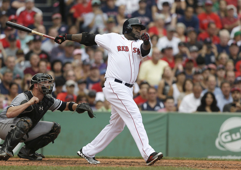 Boston's David Ortiz hits an RBI double off a pitch by Chicago's Andre Rienzo as White Sox catcher Tyler Flowers watches in the second inning at Fenway Park in Boston on Sunday. The Red Sox won, 7-6.
