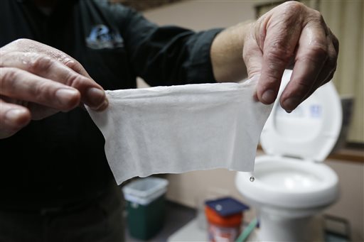 Rob Villee, executive director of the Plainfield Area Regional Sewer Authority in New Jersey, holds up a wipe he flushed through his test toilet in his office. Increasingly popular bathroom wipes – thick, premoistened towelettes that are advertised as flushable – are creating clogs and backups in sewer systems around the nation.