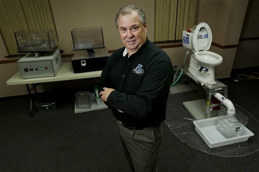 Rob Villee, executive director of the Plainfield Area Regional Sewer Authority in New Jersey, poses with his test equipment in his office in Middlesex, N.J. Increasingly popular bathroom wipes, thick, premoistened towelettes that are advertised as flushable, are creating clogs and backups in sewer systems around the nation. The problem has gotten so bad in this upstate New York town that frustrated sewer officials traced the wipes back to specific neighborhoods, and even knocked on doors to break the embarrassing news to residents that they are the source of a costly, unmentionable mess.