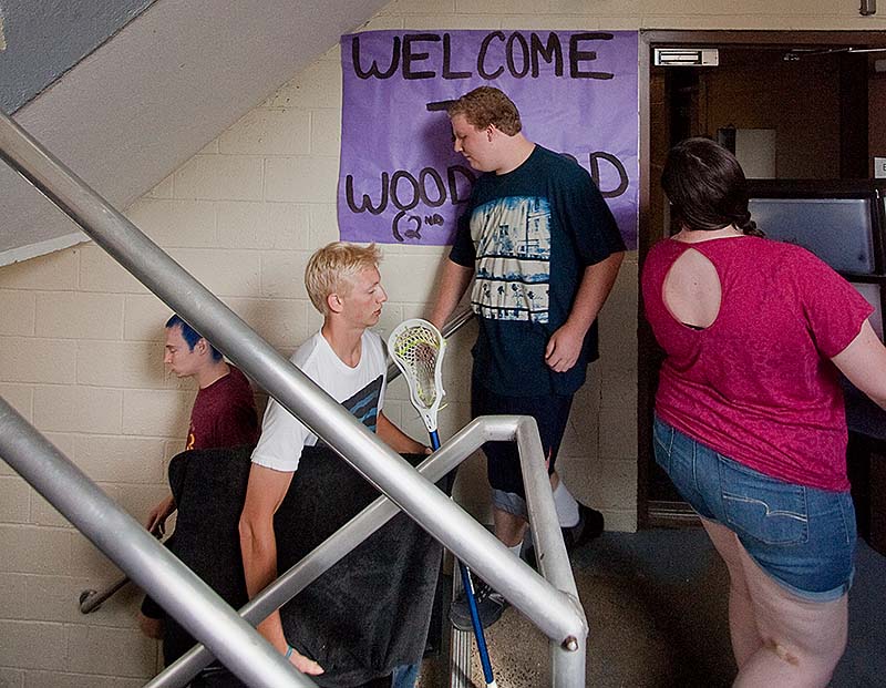 Parents and siblings help move incoming freshman into Woodward Hall at USM in Gorham on Sunday.