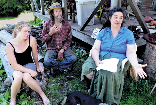 In this file photo from July 15, abutting landowners, from left, Elizabeth Smedberg and Harry and Cindy Brown, were expressing their concern about a proposed cellphone tower on Abijah Hill Road in Starks. Cindy Brown has since been charged with assault for allegedly spitting on a selectman.