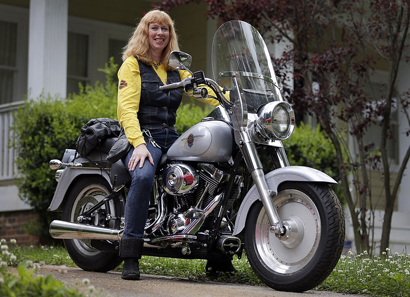 Crystal Swift poses on her Fat Boy Harley-Davidson in Charlotte, N.C. Harley is the top seller of motorcycles in its class in the U.S. and leads among women, minorities and younger adults.