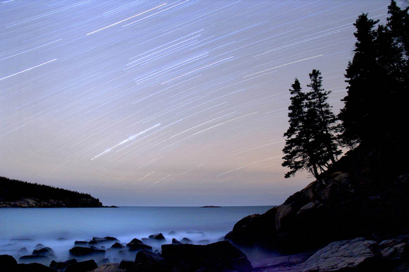 In this 2006 file photo, stars streak across the sky in a 75-minute time-exposure at Acadia National Park. The star-filled night skies are being celebrated during the fifth annual Acadia Night Sky Festival which began Thursday, Sept. 26, 2013 and runs through Sunday.