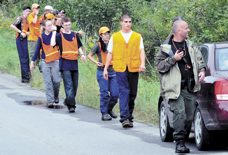 Members of Dirigo and Unity College Search and Rescue teams spread out before searching a field and woods near 344 East Benton Road in Benton for missing Arthur Wakeman, 86, on Thursday, Sept. 12, 2013.