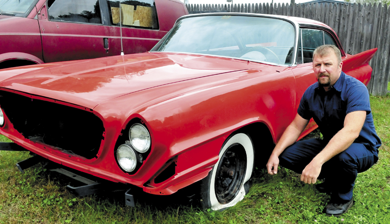 Dominick Rinaldi Jr. shows the damage to a rare 1961 Chrysler 300G that was vandalized last weekend at his shop in Skowhegan, where it was undergoing restoration. He said he hopes the boys who caused the damage get the help they need.