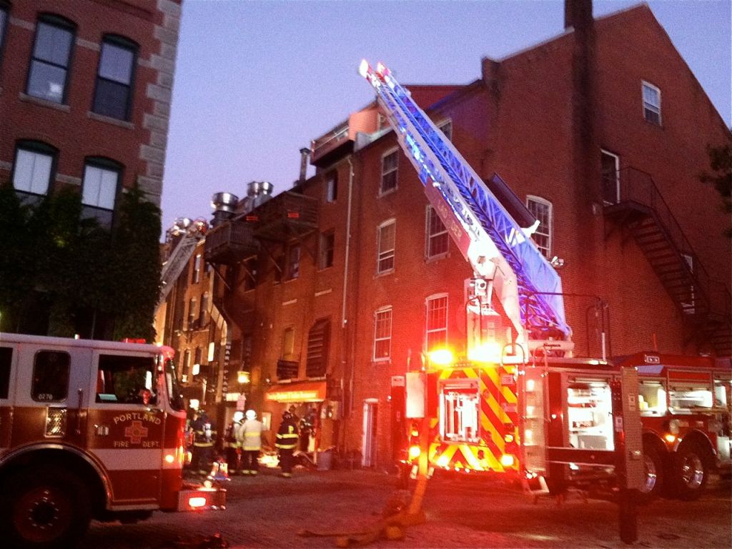 Firefighters respond to the scene of a fire in the 400 block of Fore Street early Thursday morning.