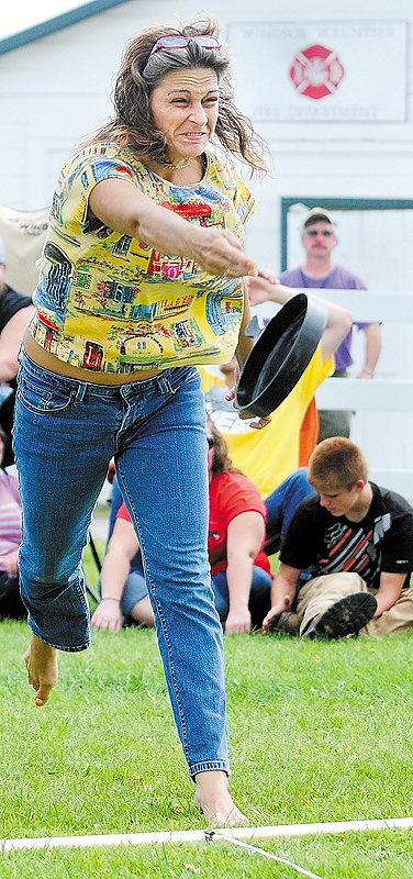 Jodi Lucas, 41, of Auburn competes in the Ladies Skillet Toss contest on Saturday at the Windsor Fair.