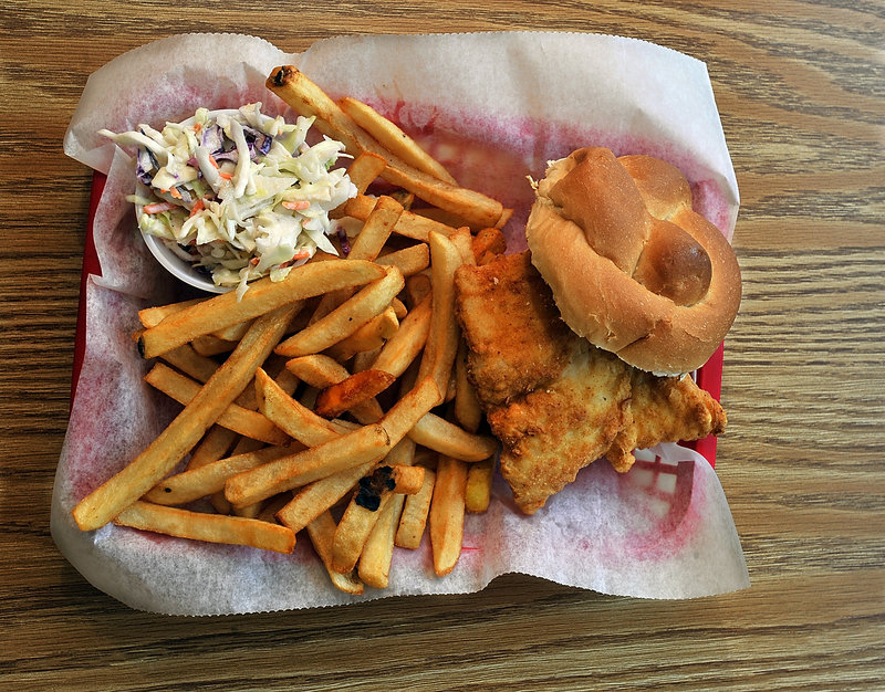 At Charlie’s Diner, the fried haddock sandwich is served with fries and slaw. And breakfast is served all day.
