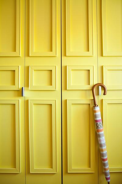 Doors are customized with moldings created by sticking on pieces of wood using Command picture hanging stripsfrom 3M.