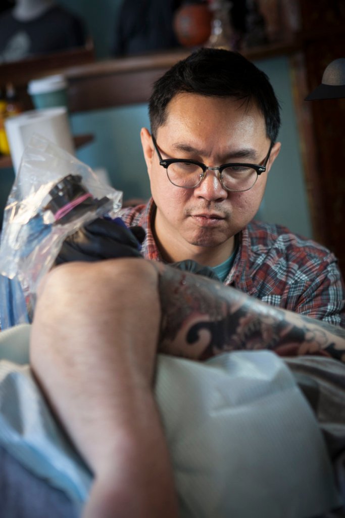 Phuc Tran of Tsunami Tattoo, in Portland, is part of the new wave of tattoo practitioners, college-educated businessmen with detailed professional portfolios. Tran considers himself a “tattoist” or “tattoer.”