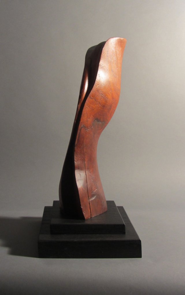 “Abstract Form” by Robert Laurent, c. 1915, carved wood on a separate wood base.